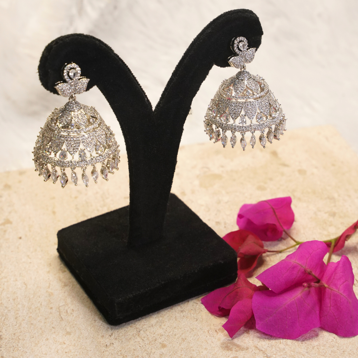 Noira Diamond Finish Crystal Jhumka Earrings
