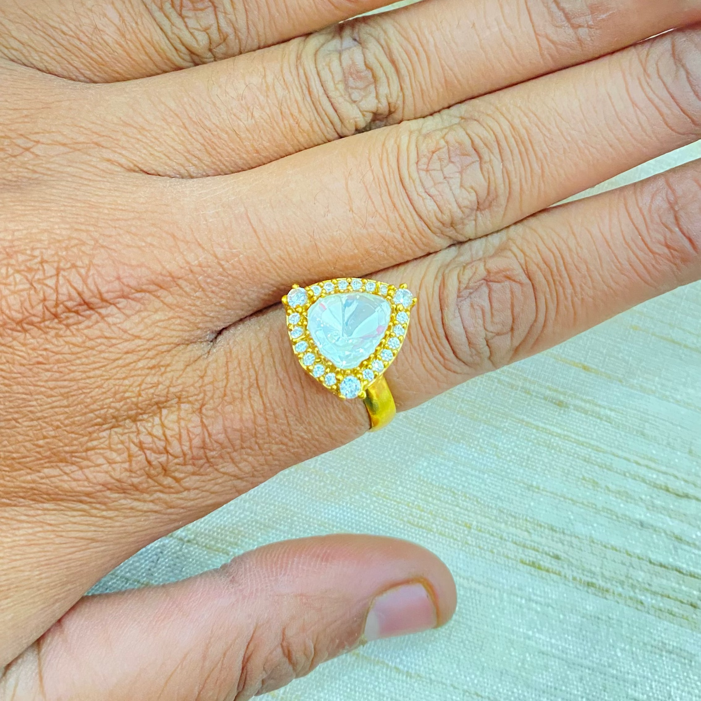 Majestic triangular Moissante ring